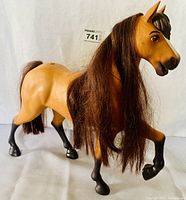 Side/front view of electronic prancing palomino horse figure with mane and tail