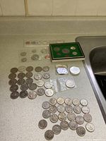 Overview of entire lot showing mint sets, loose coins and commemoratives