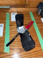 Survival tool set case open showing multitool and inside fabric pouch