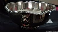 Silver plated centerpiece bowl showing scalloped rim and reflective surface with some tarnishing.