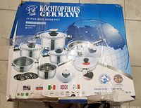 Box front showing set and branding details, model Emerald IN 771, 18/10 stainless steel, 17 pieces wide edge pot set.