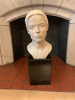 Frontal view of the plaster bust showing the detailed face and base.