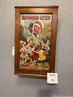 Front exterior of wooden cabinet with full Diamond Dyes painted graphic