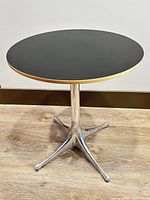 Full view of pedestal side table showing tabletop and base