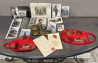 Full lot displayed on table showing photographs, badges, buckles and face masks
