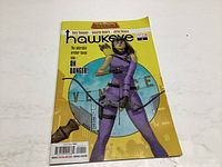 Front cover of Hawkeye #1 comic book showing the superhero in a purple outfit with a bow and arrow.