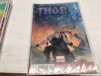 Photo of the Thor: God of Thunder #2 comic book showing the front cover featuring Thor and Gorr the God Butcher.
