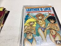 Photo showing Leather & Lace Summer Special 1980 comic book with three cartoon characters in swimwear on cover.