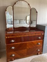 Front view of dresser and attached triple mirror