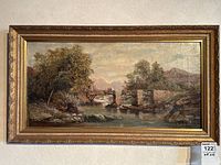 Full view of framed painting showing bridge landscape with two figures