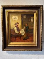 Full view of the framed oil painting showing father and son in interior