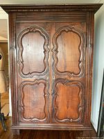 Front view of wardrobe showing double doors and cornice