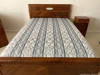 Full view of bedframe with mattress from footboard angle