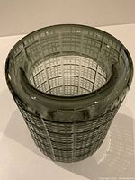 Top-down angle showing the rounded lip and inner grid cut pattern of the glass vase.