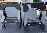 Front view of two DeWalt plastic saw horses showing size and design.
