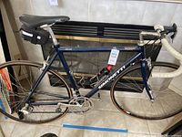 Full side profile of bicycle showing frame, wheels, handlebars and accessories