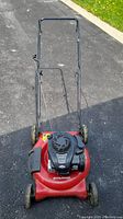 Front angled view of the red Murray gas lawn mower with black handle.