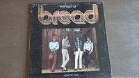 Front cover of The Best of Bread Volume Two vinyl album showing band photo and title.