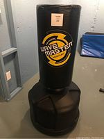 Front view of black freestanding punching bag with visible Century Wavemaster logo and MaxSold lot label 22.