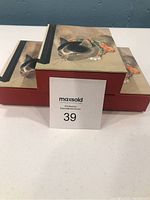 Three boxed sets of cat-themed note cards from The Metropolitan Museum of Art arranged side by side, showing the top design with a cat and butterfly illustration.