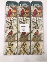 Three packaged sets of 4 stone coasters each with bird nesting illustrations.