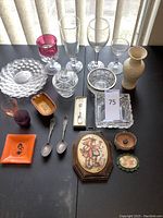 Overhead photo of all vintage glassware, dishes, flatware, and decor items grouped on table