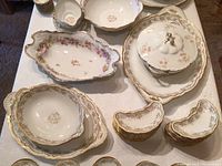 Overhead view showing serving bowls, platters and small kidney dishes