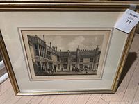 Two vintage English scene prints in gold-colored frames approximately 28x20 inches.
