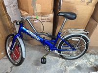 Side view of blue Schwinn folding bicycle showing frame, front wheel with fender, handlebars, and black seat.