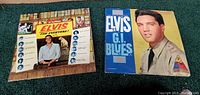 Front covers of two Elvis Presley LP records: 'For Everyone!' with indoor casual photo and 'G.I. Blues' with Elvis in army uniform.