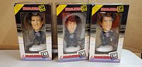 Front view of all three boxed bobbleheads showing players Linds and Tiger