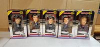 Front view of five boxed XL Headliners bobblehead figurines depicting NHL hockey players in original packaging.