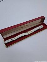 Full view of watch in open Omega box