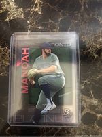 Front of Alek Manoah Bowman Platinum Rookie Card showing player pitching with 'MANOAH' in red and 'PLATINUM' branding.
