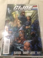 Front cover of G.I. Joe: A Real American Hero comic book issue #1 showing characters including Cobra officers and Dreadnoks, protective plastic sleeve visible