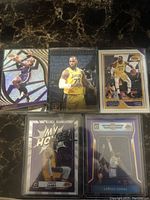 Ten assorted LeBron James basketball cards arranged showing different designs, teams, and styles.