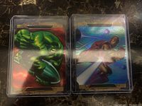 Front views of Hulk and Iron Man diecut insert cards in protective cases showing colorful artwork.