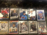 Photo showing 10 individual NHL rookie and player cards featuring players like Matthew Tkachuk, Alex Pietrangelo, Evander Kane, Mikko Rantanen, others.