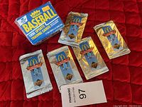 Box of 1989 Fleer Update Baseball Trading Cards and 5 sealed McDonald's Baseball Happy Meal promotional packs shown on red background.