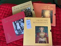 Four LP records from The Story of Great Music series with themed artistic covers representing different historical music periods.