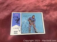 Front of 1974 OPC Bobby Hull WHA hockey card with Bobby Hull signature in black marker over the image of Hull in Winnipeg Jets uniform