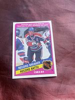 Front view of 1982-83 O-Pee-Chee Wayne Gretzky Score Record hockey card #388 in high grade condition, featuring image of Gretzky in Edmonton Oilers jersey skating with 'RECORD BREAKER' inscription.