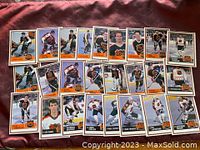 Full spread of 25 NHL hockey cards from the 1990-91 Kraft Dinner Jell-O series with players in NHL uniforms, laid out on a red fabric.