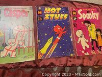 Photo showing all three comics - Casper, Hot Stuff, and Spooky Harvey Comics from 1967/1968 with visible aging and wear on covers.