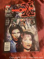 Front cover image showing full comic book with title, Topps Comics logo, and characters Mulder & Scully illustrated, includes inset images of additional comic covers and text details.