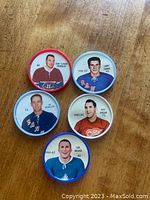 Front side of all five hockey coins showing player images, names, teams, and years.
