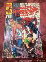 Front cover of the comic book showing Spider-Man and children skating on thin ice with bright red and blue title.