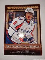 Front of Alexander Ovechkin 'Biography of a Season' hockey card showing Ovechkin in Capitals uniform with date and trophy info.