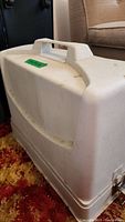 White plastic carrying slipcover case for Brother VX808 sewing machine, with handle and latch, showing dirt and wear.