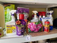 Photo showing various gardening sprays, fertilizer boosters, and repellents displayed on a shelf.